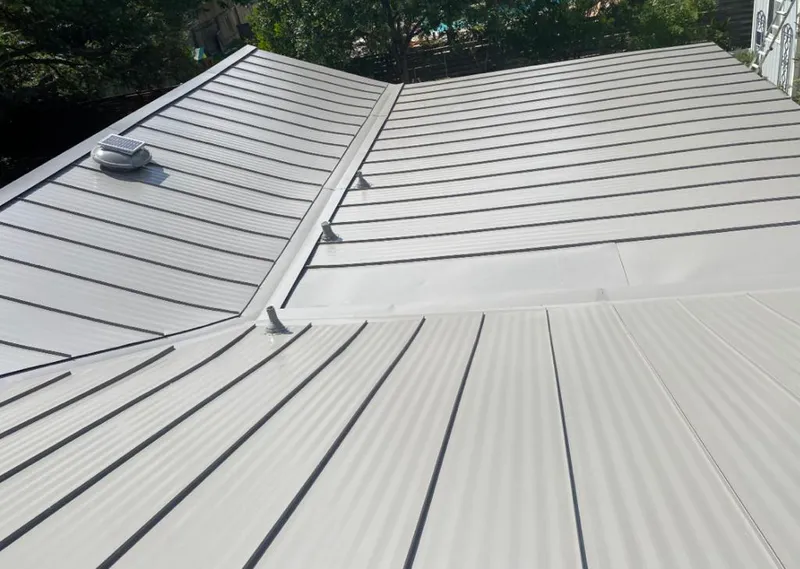 Solar attic fan installed on a metal roof for Roof Ventilation in Maili